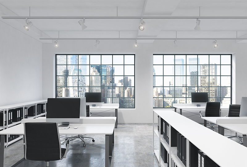 Workplaces in a bright modern loft open space office. Tables are equipped with modern computers; corporate documents' shelves. New York panoramic view. 3D rendering.