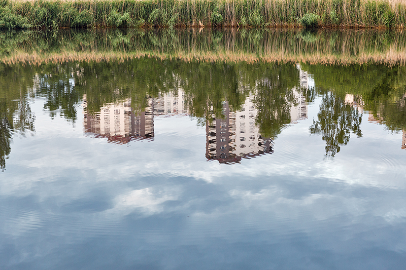modern urban residential architecture with park lake. reflection in the water